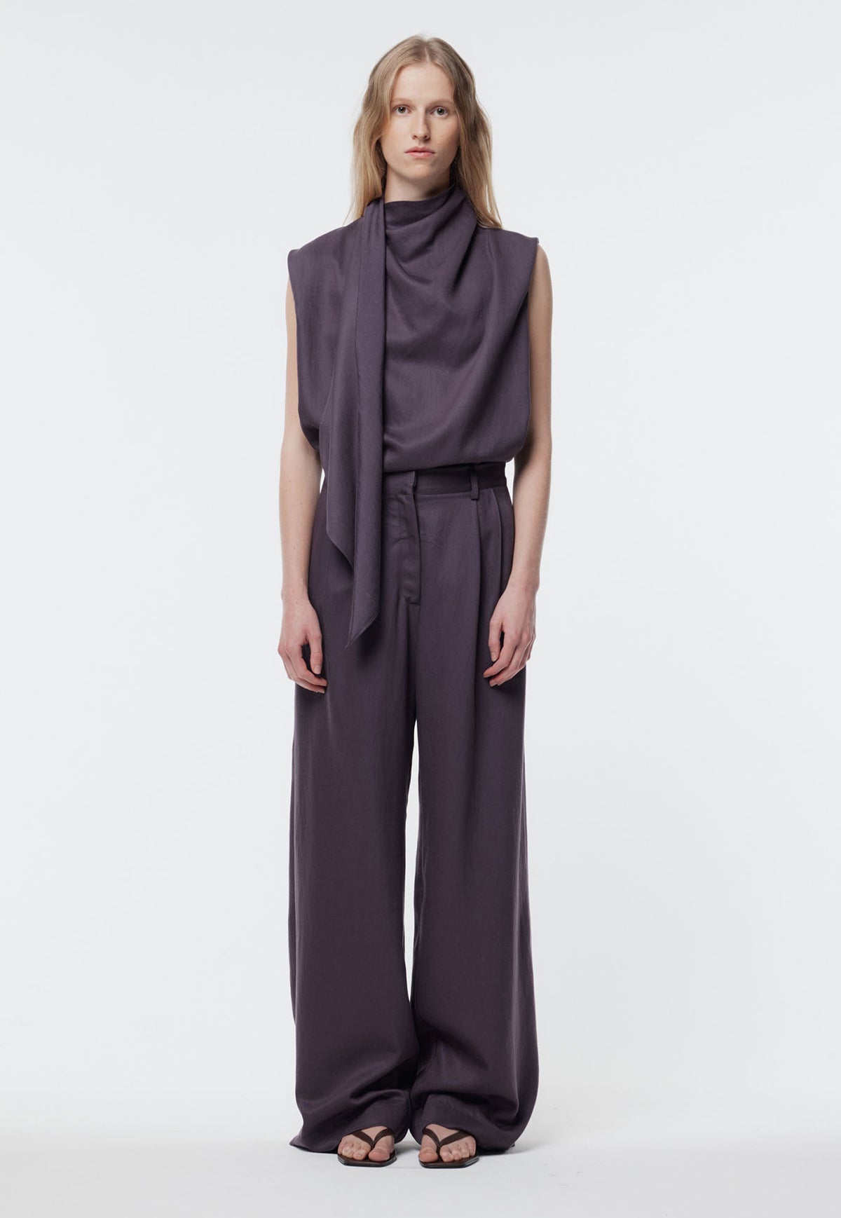 Gregory, Broun Pant in Shadow Iris. A dark plum wide-leg trouser. Featuring a deep pleat at the waistband and side pockets.