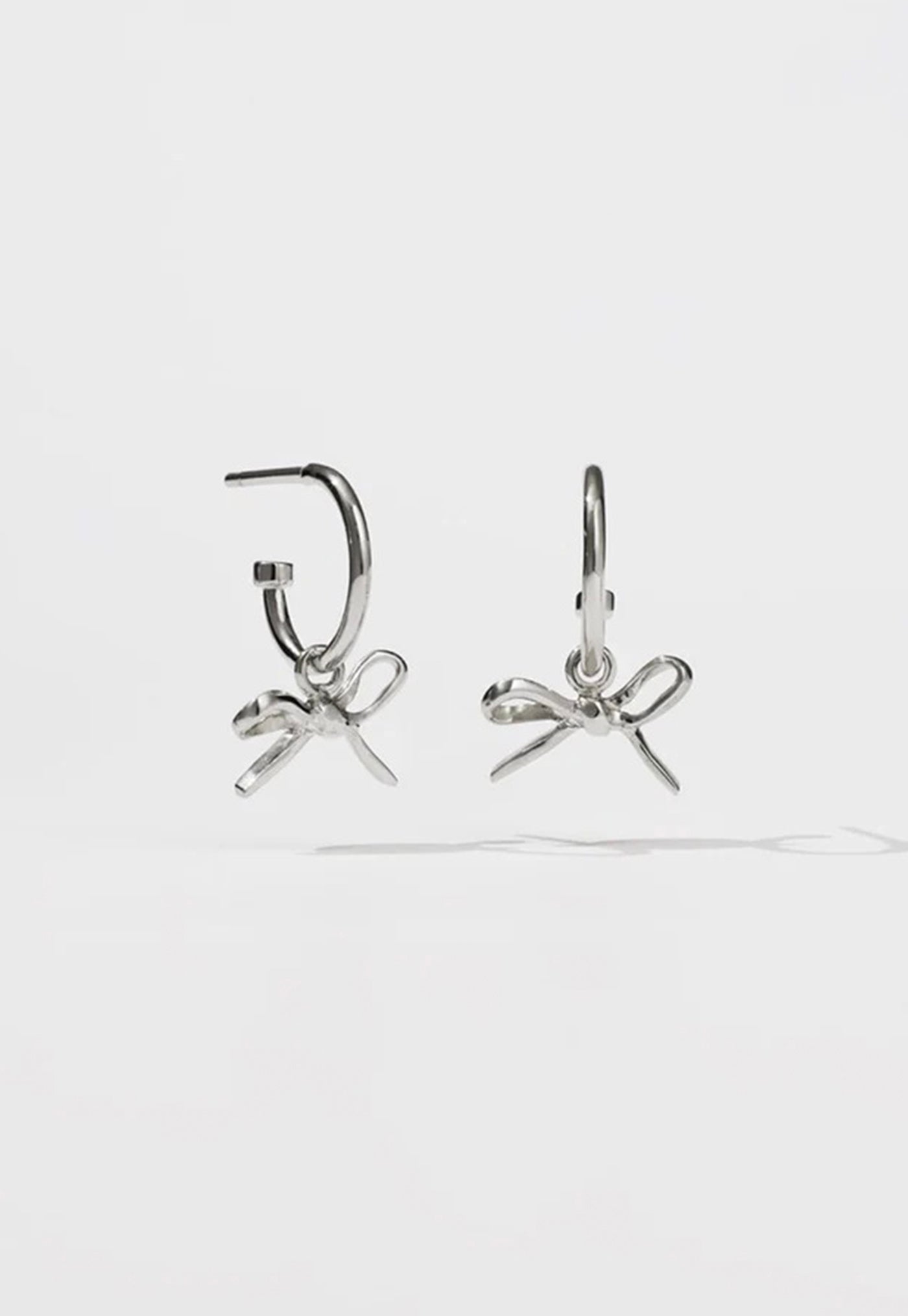 Bow Signature Hoops sold by Angel Divine