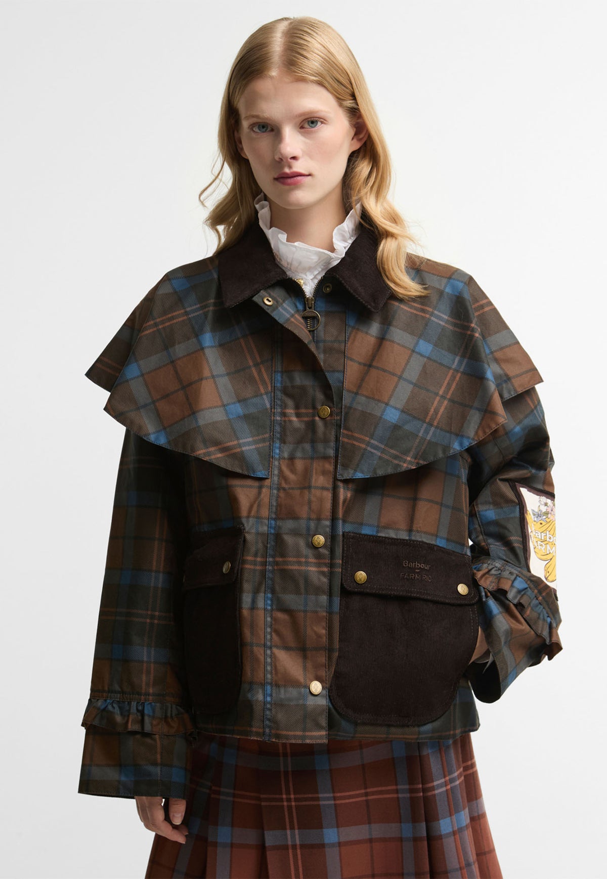 Barbour x FARM Rio Angelina Waxed Jacket in Tropical Tea Tartan, tartan waxed cotton jacket with caped shoulders and frilled cuffs.