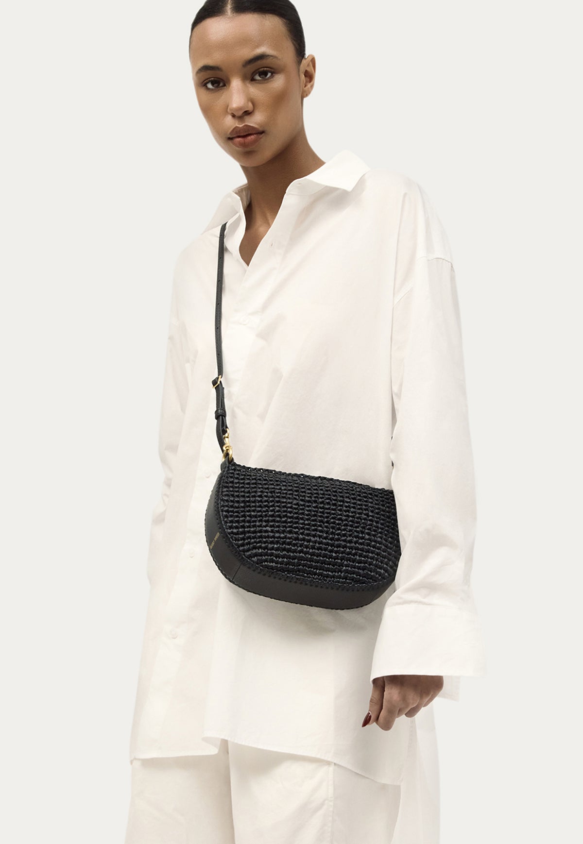 Deadly Ponies Mini Sling Bag in Black Raffia/Black with detachable adjustable shoulder strap.