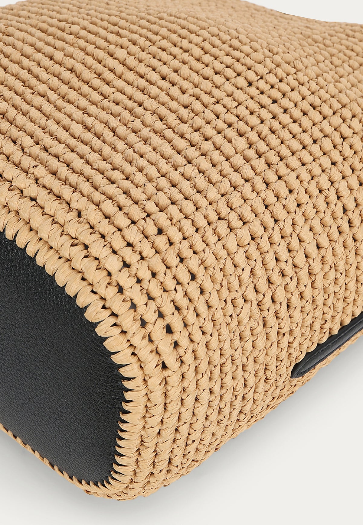 Close-up of the handwoven natural raffia texture on the Deadly Ponies Rush Tote.