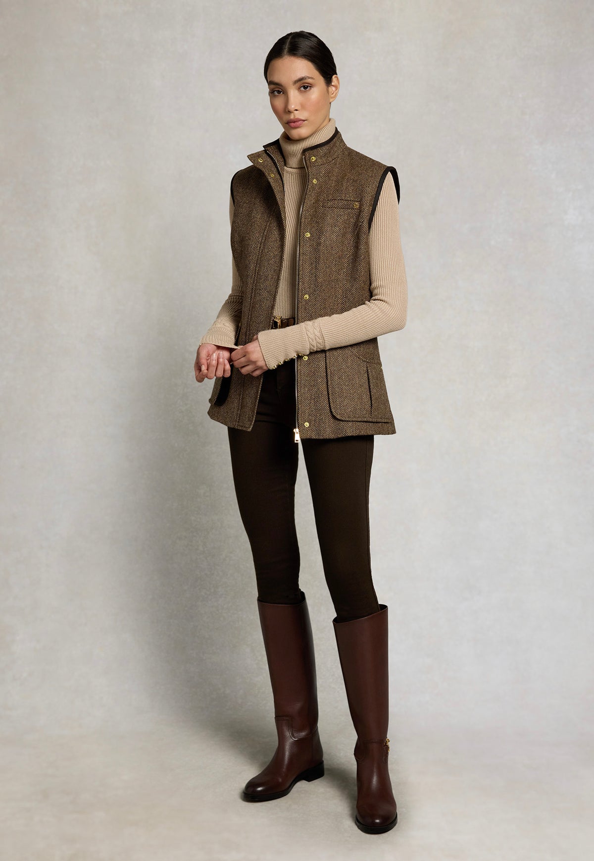 Holland Cooper Country Classic Tweed Gilet in Large Scale Brown Herringbone, featuring patch pockets and a stand collar.