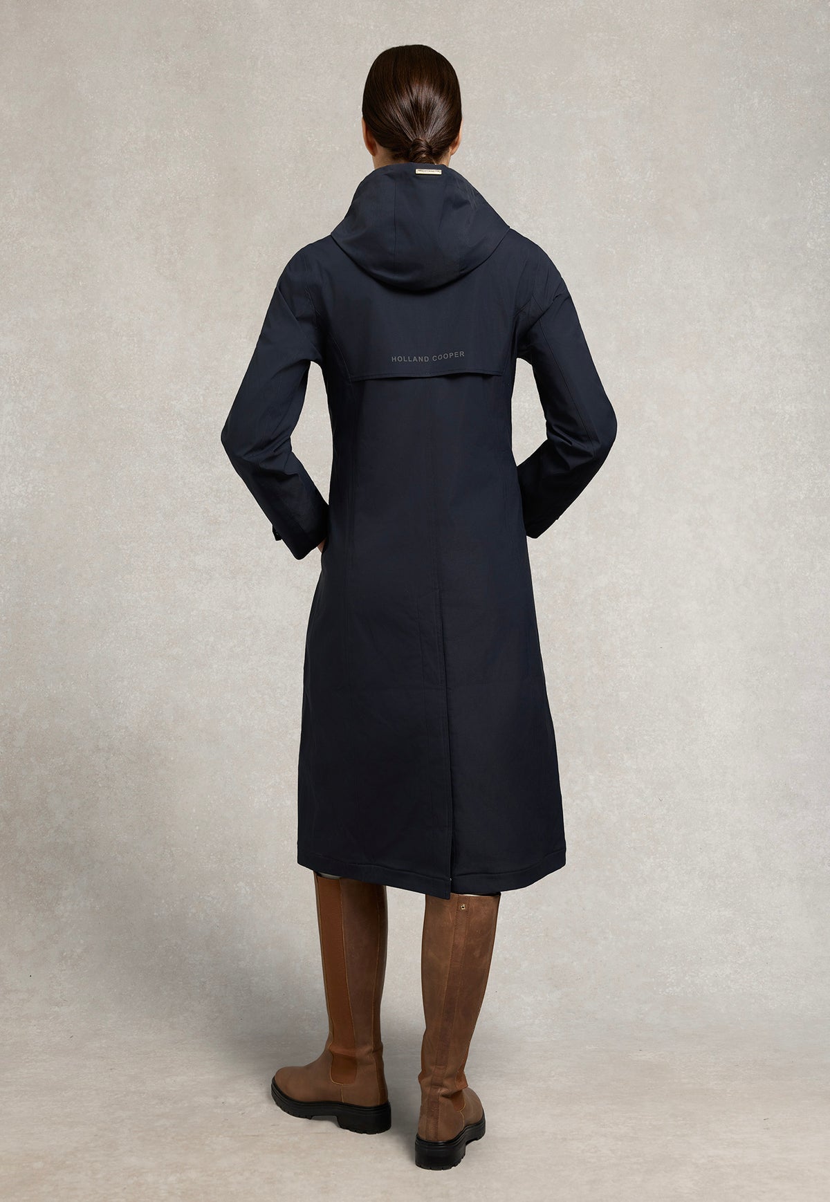 Back view of the Holland Cooper Folgate Rain Coat in Ink Navy, showing the longline cut and centre-back vent.