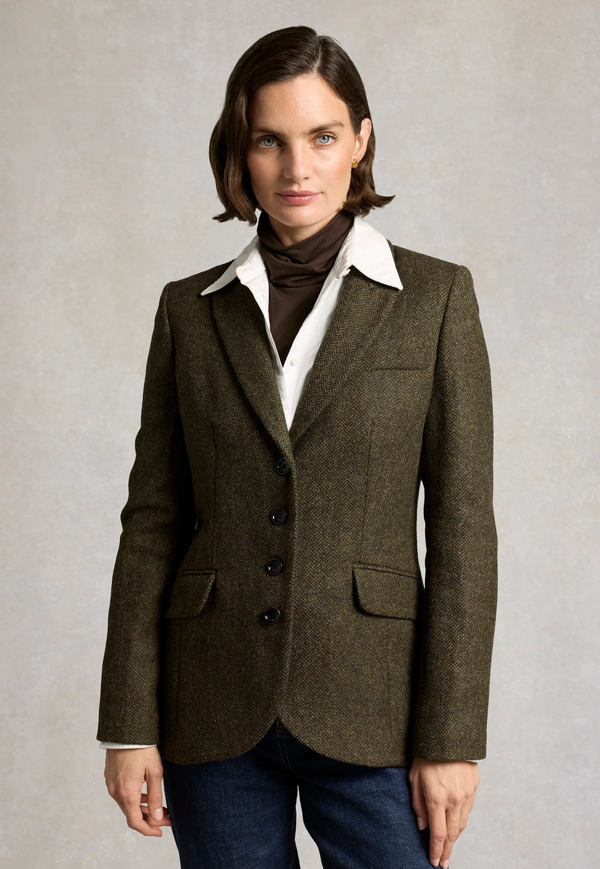 Front view of the Holland Cooper Hacking Jacket in Dark Green Herringbone.