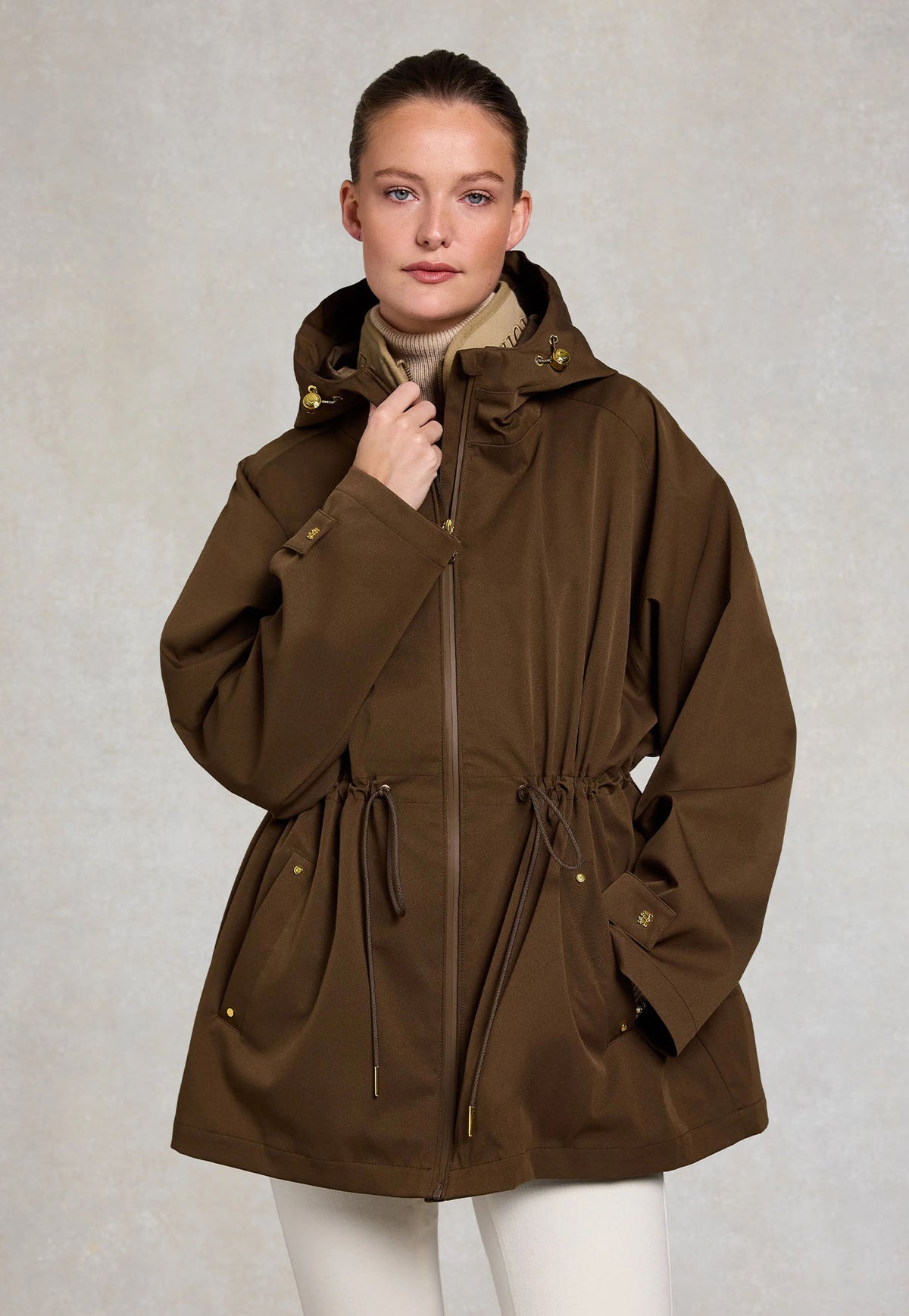 Holland Cooper One-Size Lightweight Waterproof Parka in Chestnut, chestnut brown lightweight waterproof parka with drawstring waist and faux leather piping.