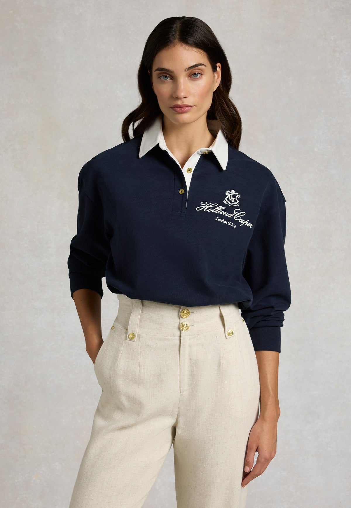 Holland Cooper Rugby style Shirt in in navy. With embroidered Holland Cooper crest on front & a white collar.