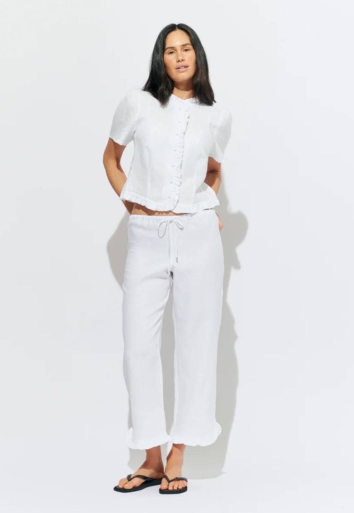 RUBY Arlo Linen Top in White, short-sleeve linen blouse with ruffle neckline, button-front closure and semi-cropped fit.