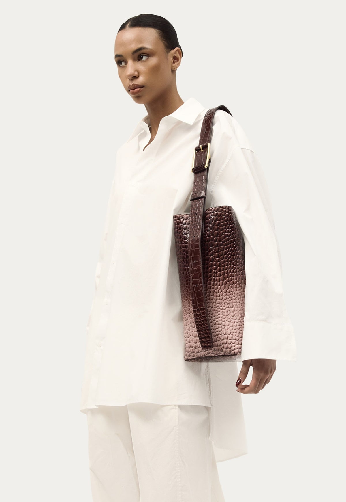 Deadly Ponies Bellboy Tote in Eclipse Croc featuring an adjustable leather strap with brass buckle.