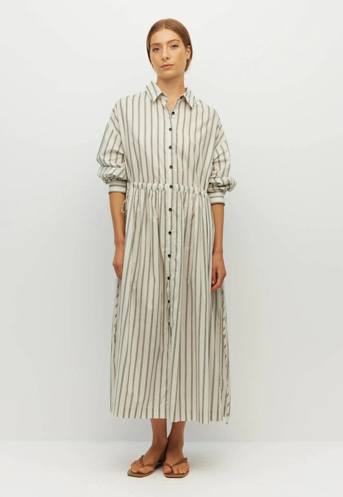 Juliette Hogan long-sleeve button-front midi dress with vertical pine green and off-white stripes, an optional gathered waist.