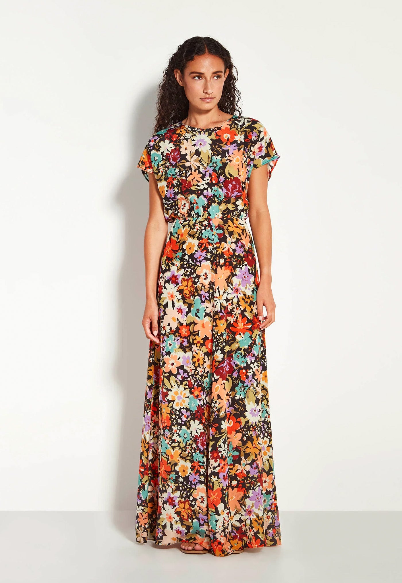 Woman wearing a floral dress on a white background