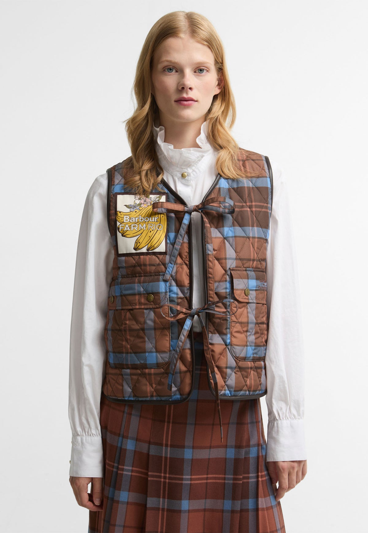 Barbour x FARM Rio Fernanda Liner in Tropical Tea Tartan, tartan quilted liner with bow fastenings.