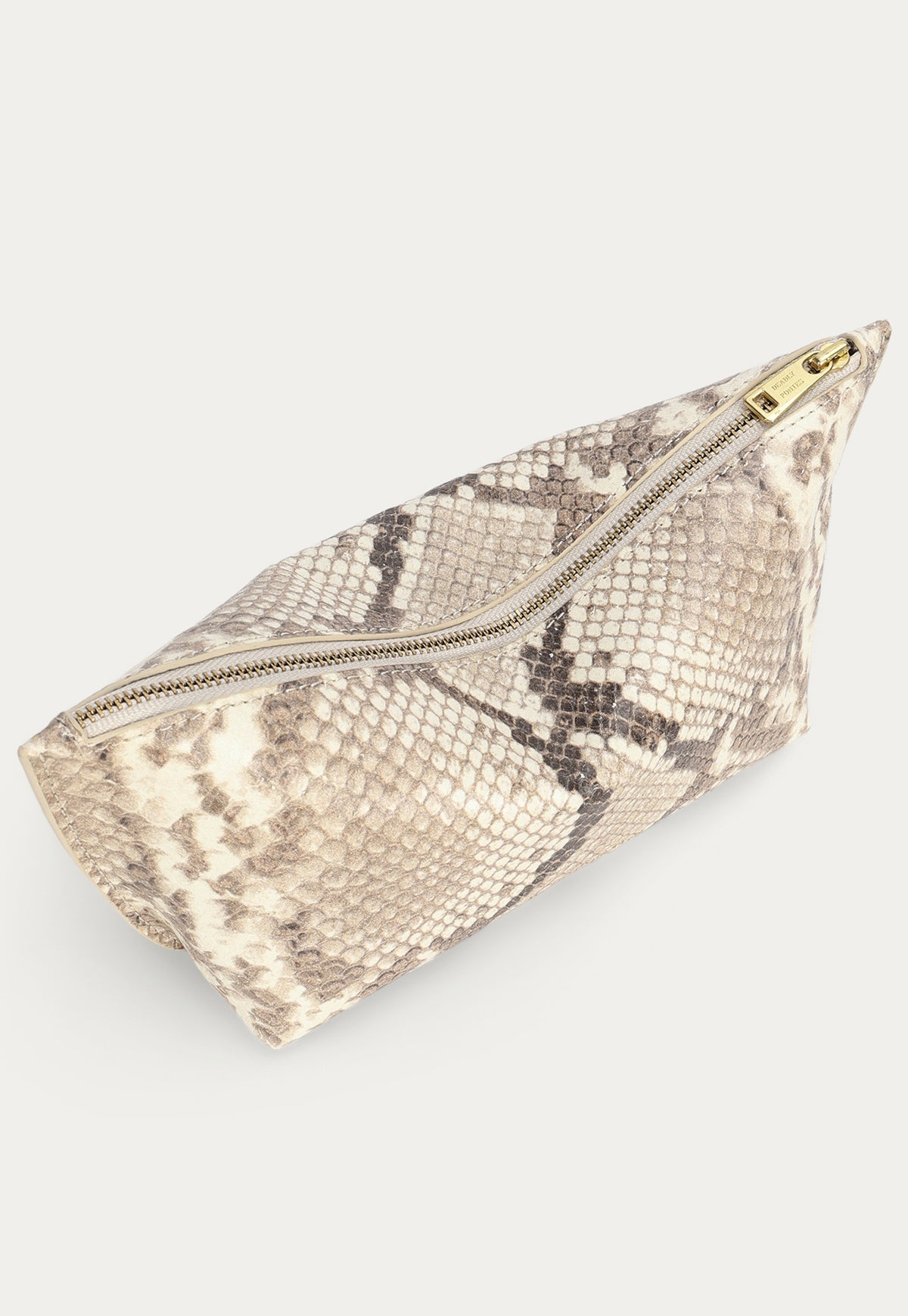Close-up of the python-embossed calf leather texture on the Deadly Ponies Medium Poucher in Desert Python.
