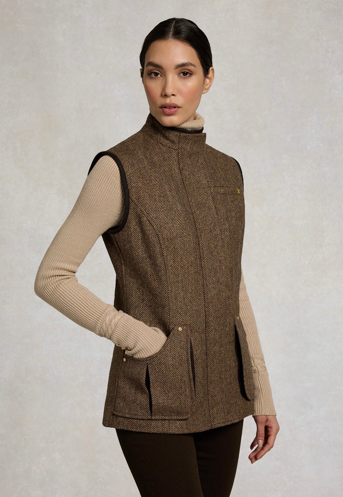Holland Cooper Country Classic Tweed Gilet in Large Scale Brown Herringbone, featuring patch pockets and a stand collar.