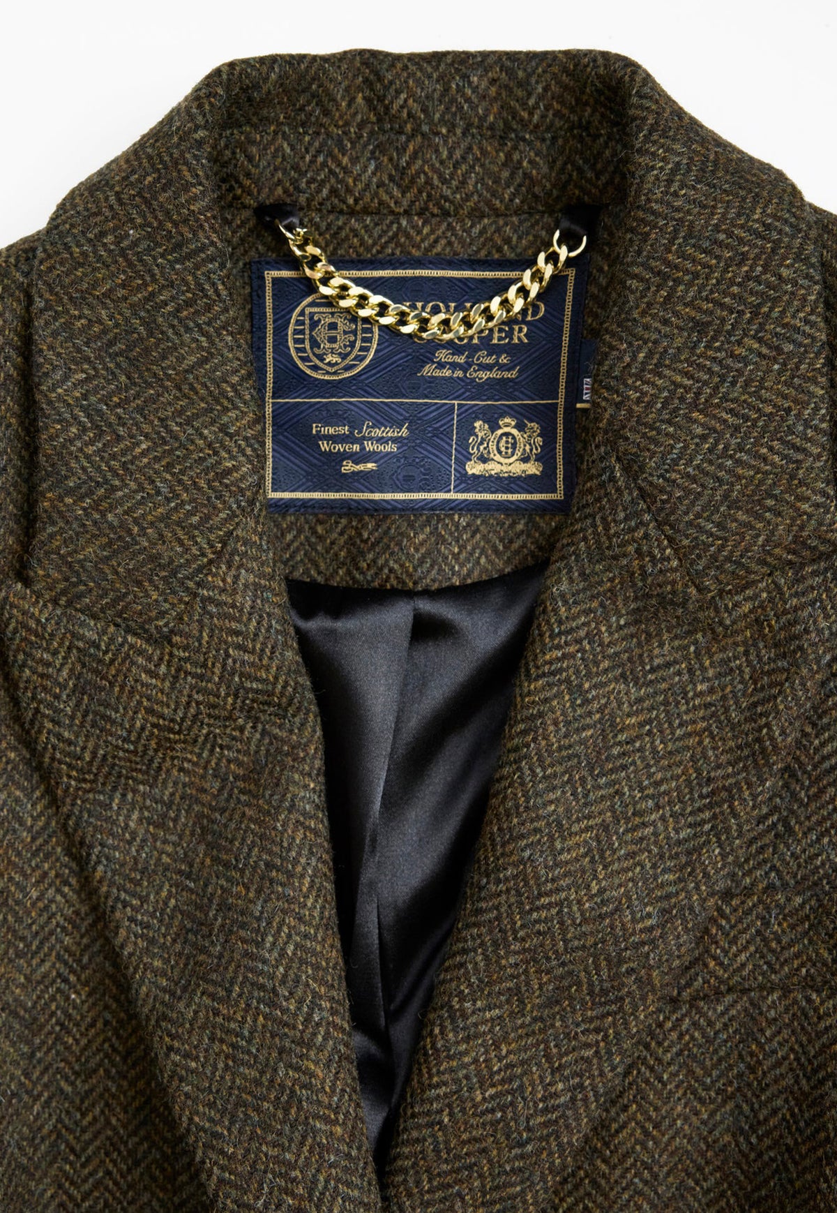 Close up of the Holland Cooper Hacking Jacket showing the Dark Green Herringbone tweed in more detail.